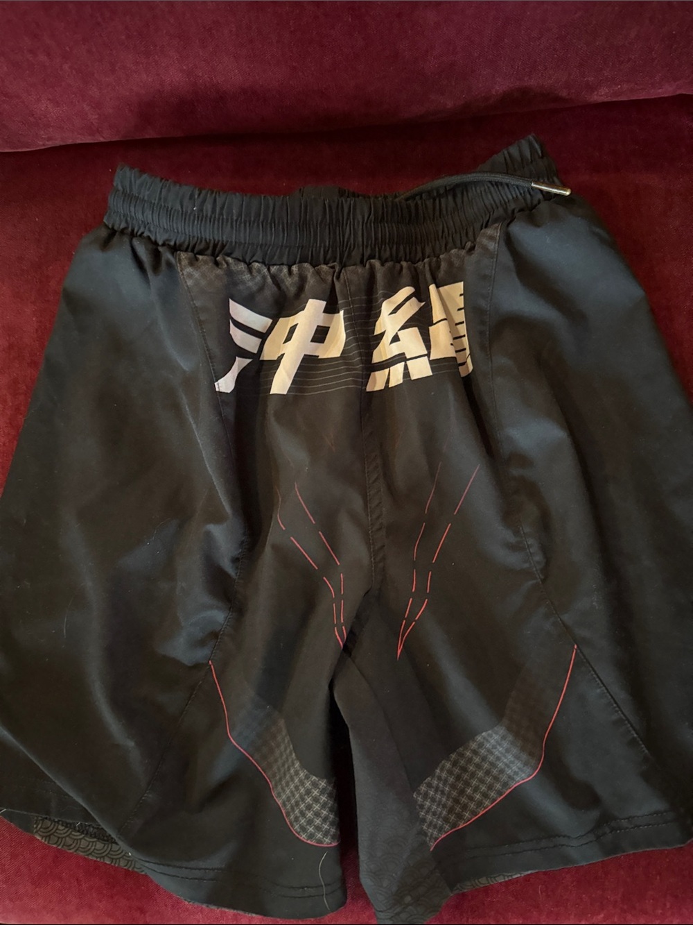 VENUM Black Athletic Shorts with Subtle Red Accents